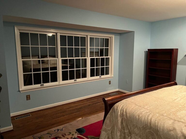 Bedroom with blue painted walls.